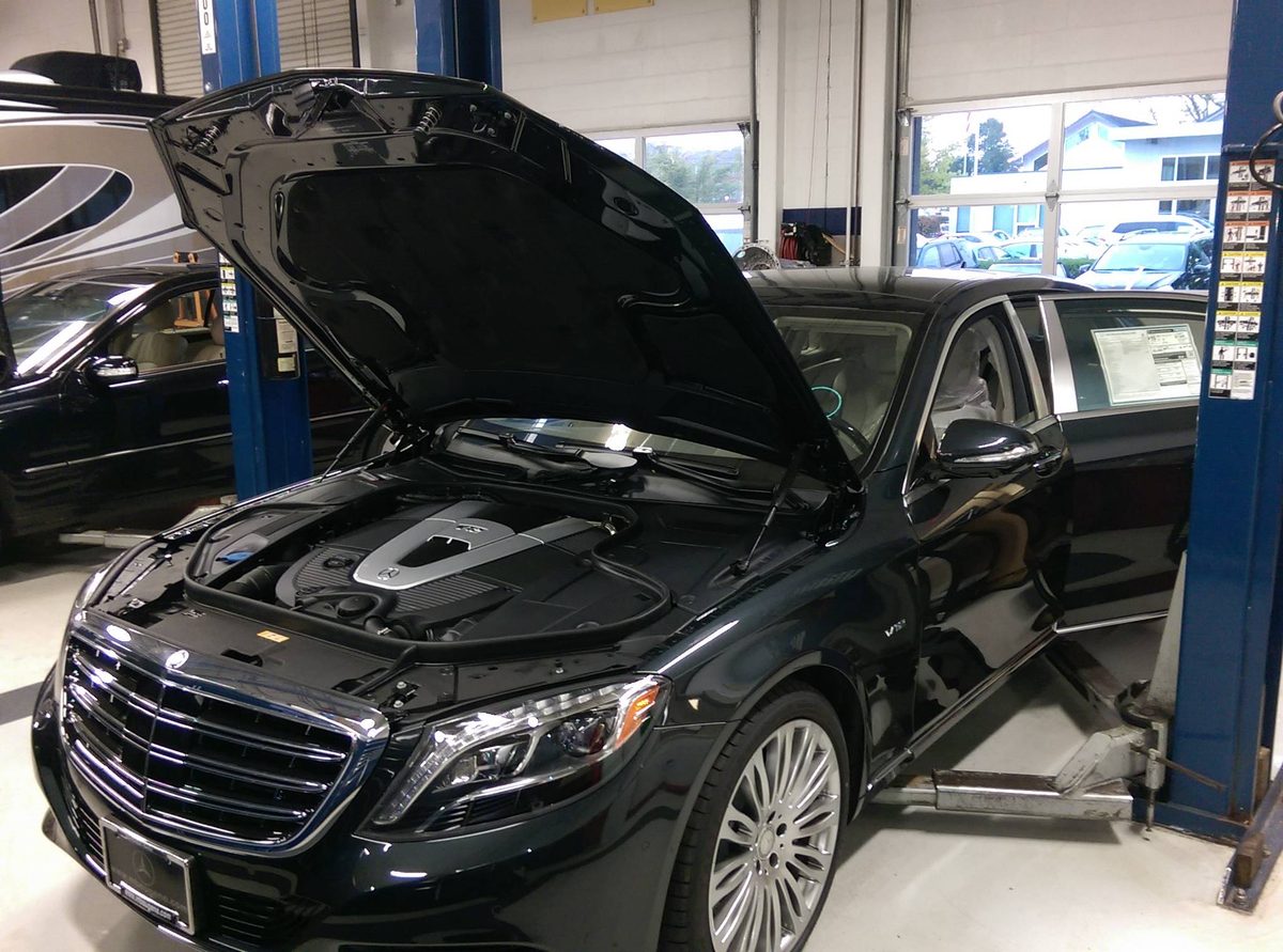 A Mercedes-Maybach on the lift at Apex Automotive